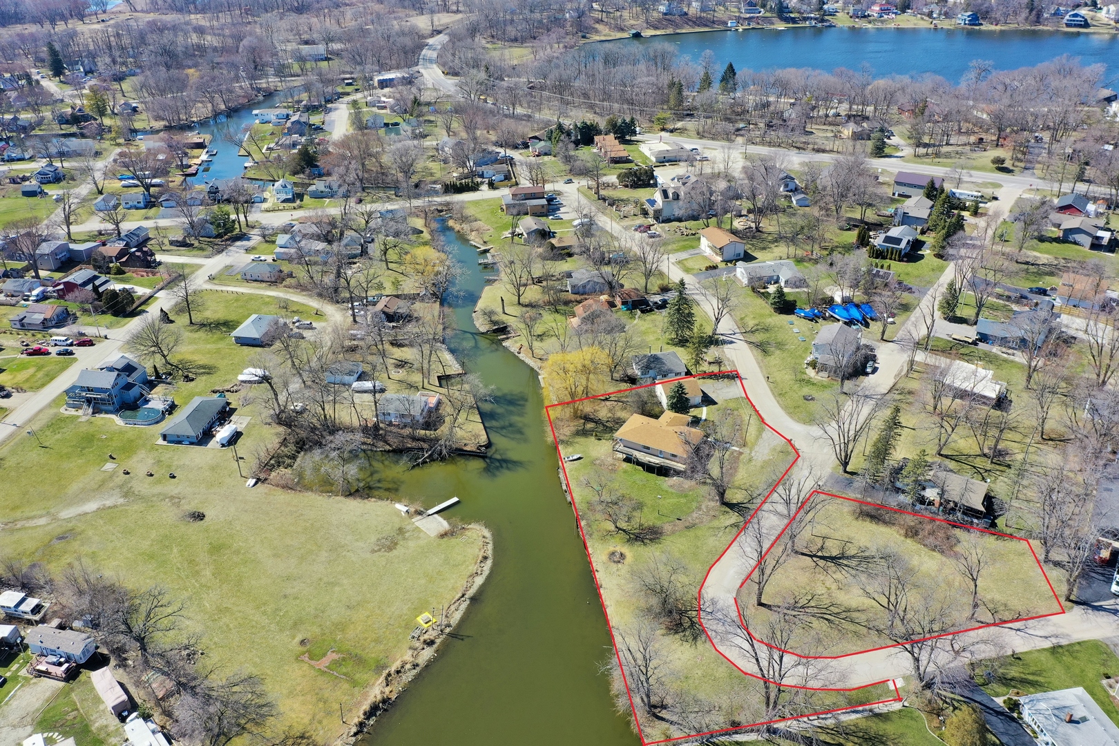26075 Riverview Drive Antioch, IL 60002 - Photo 34 of 41 an aerial view of a house with a yard and large trees