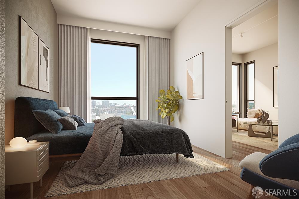 988 Harrison Street, Unit XB8 San Francisco, CA 94107 - Photo 3 of 6 a living room with a bed furniture and a large window