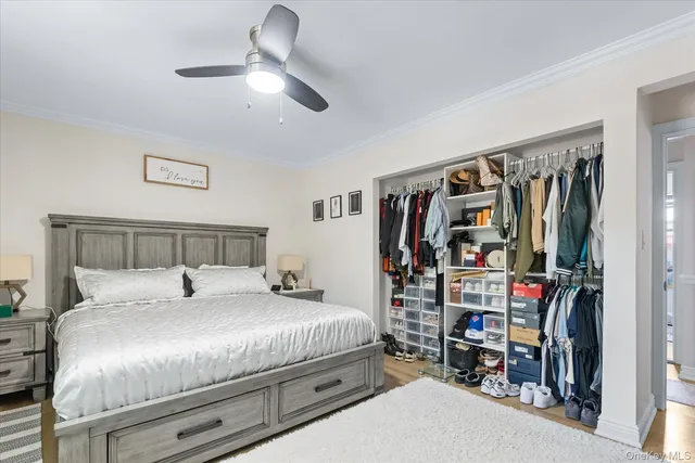 a bedroom with a bed and a walk in closet