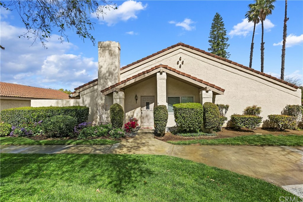 7058 Poco Senda Riverside, CA 92506 - Photo 1 of 1 a front view of a house with garden