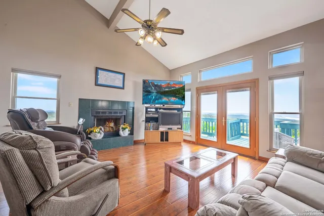 a living room with furniture fireplace and flat screen tv