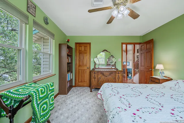 a view of walk in closet with clothes
