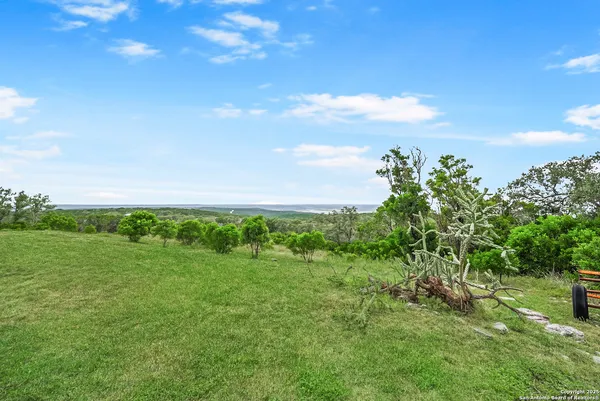 a view of a wooden deck and city view