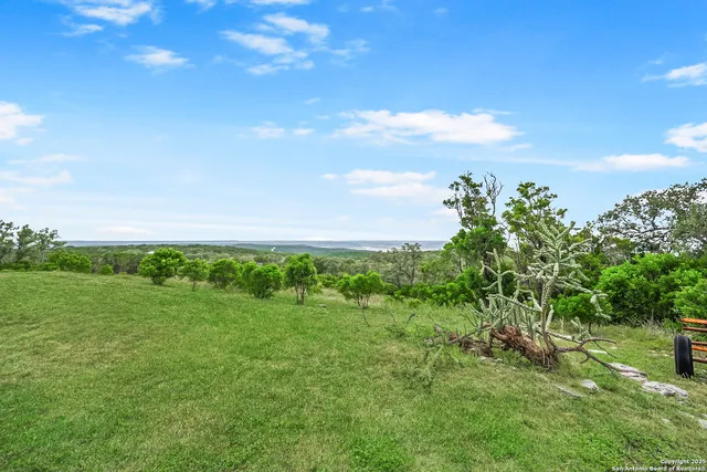 a view of a wooden deck and city view