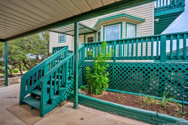 a view of a house with a yard and plants