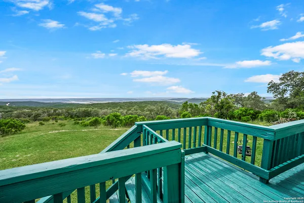 a view of a garden with an outdoor seating
