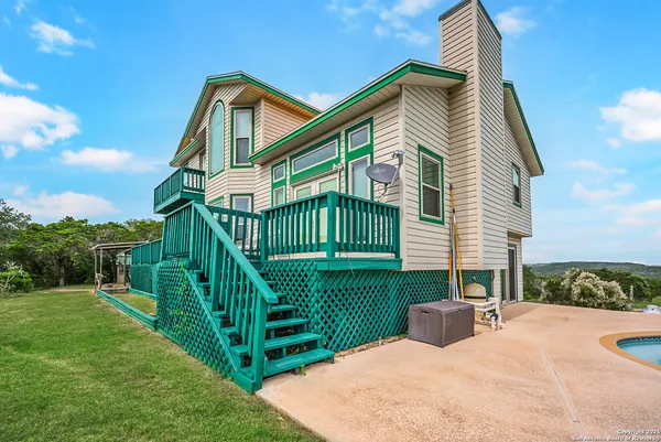 a view of a room with window and hardwood floor