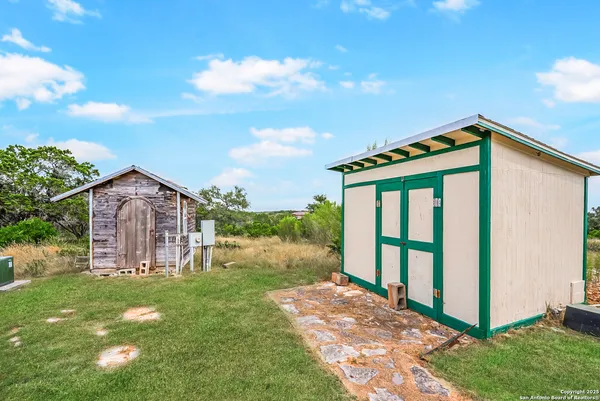 a view of house with a yard