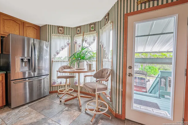a kitchen with stainless steel appliances a stove a sink and cabinets