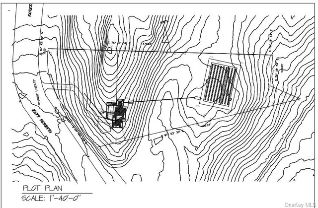 a big yard with lots of green space and house view