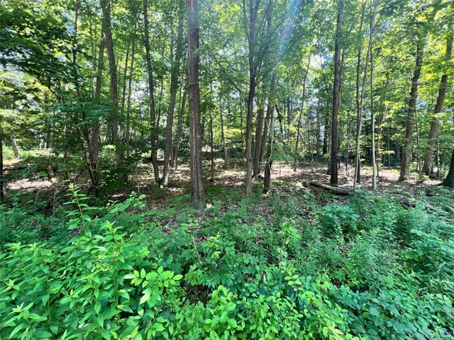 a picture of a bathroom with a white sink and a mirror