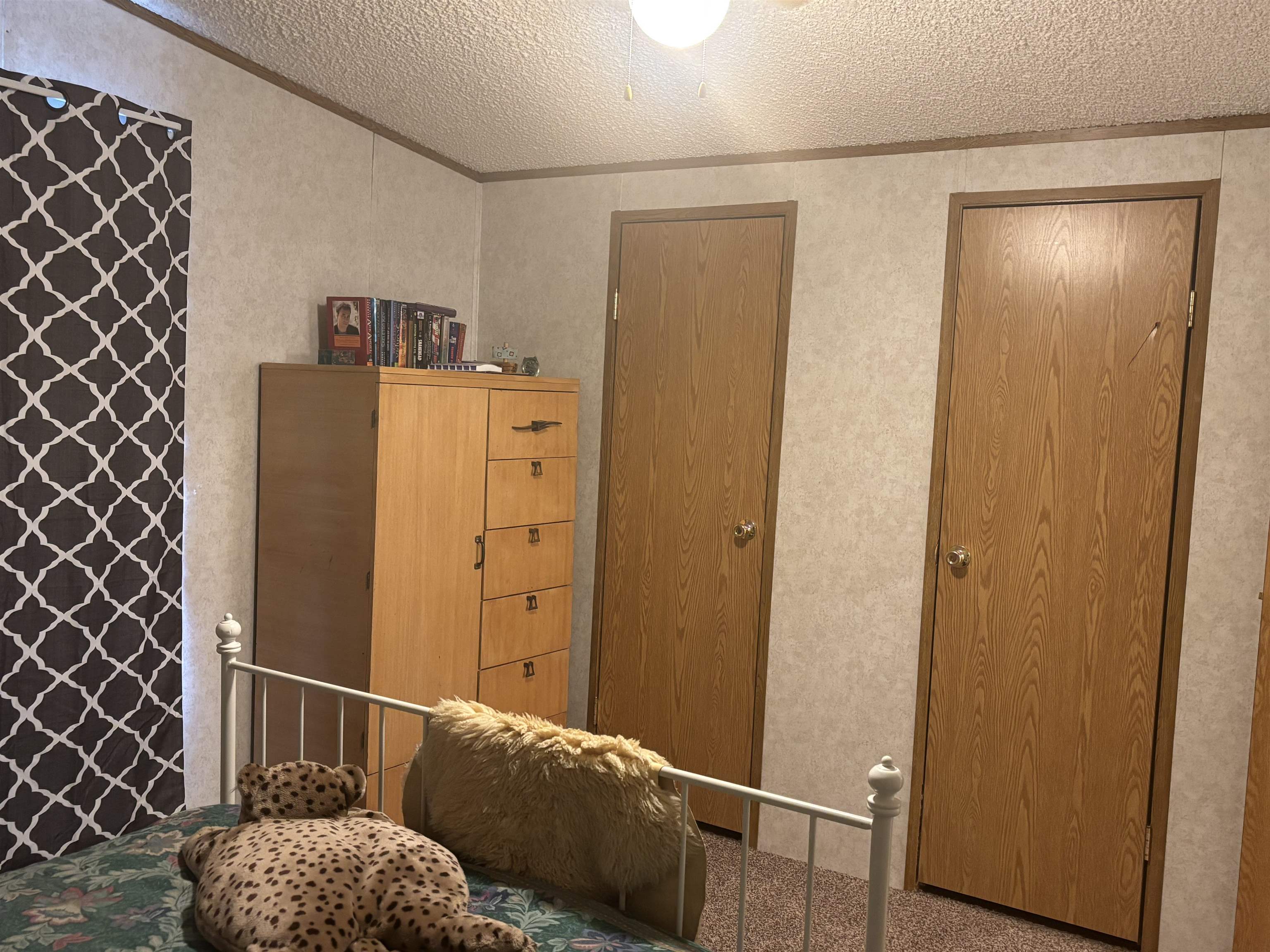 3268 E Road, Unit 90 Clifton, CO 81520 - Photo 13 of 19 a hallway with cabinets and wooden floor