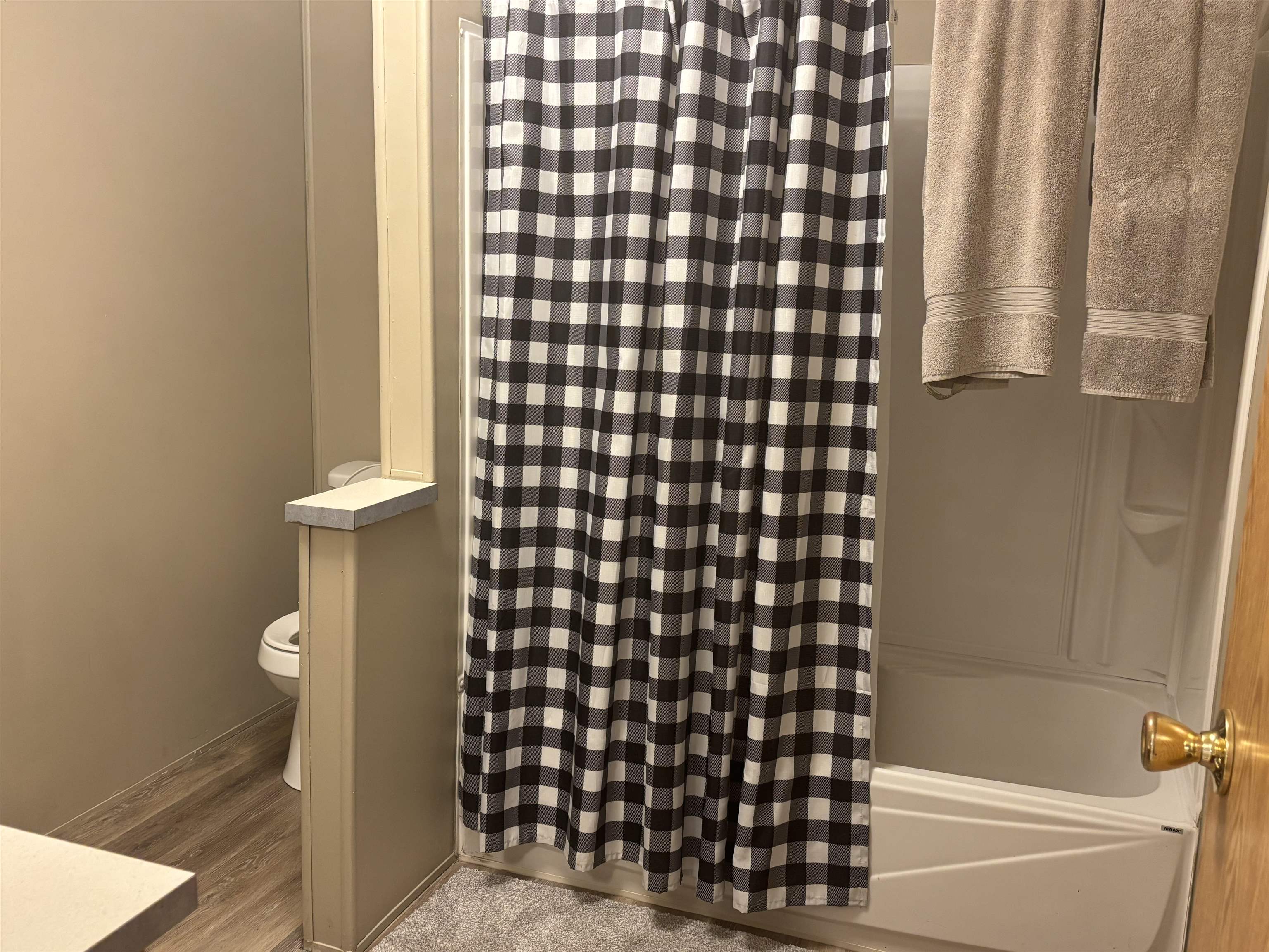 3268 E Road, Unit 90 Clifton, CO 81520 - Photo 15 of 19 a bathroom with a bathtub and shower