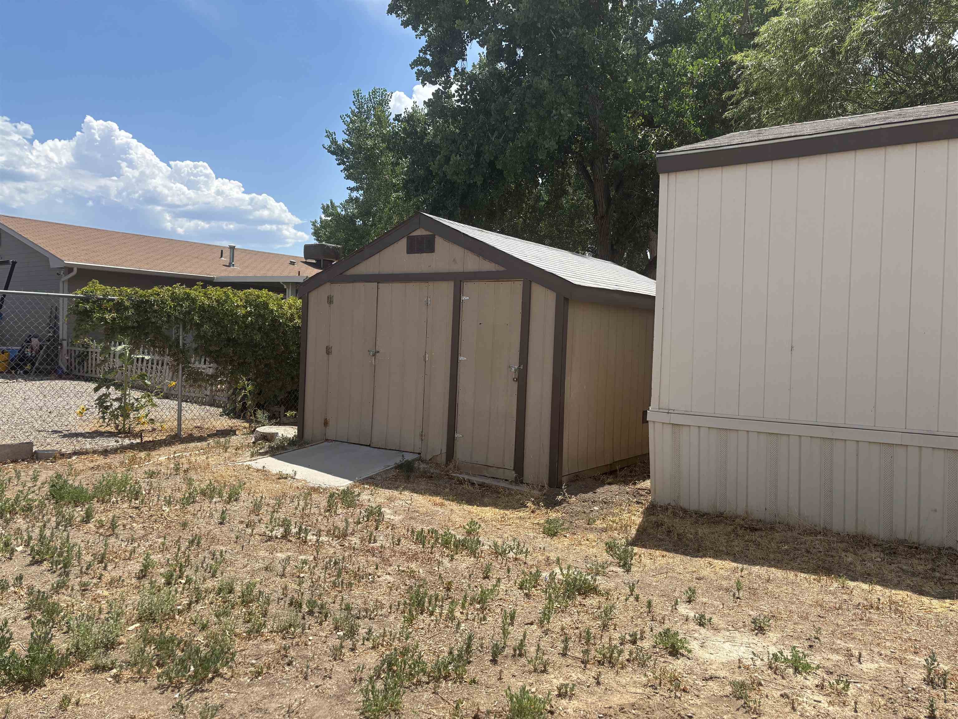 3268 E Road, Unit 90 Clifton, CO 81520 - Photo 4 of 19 a view of a backyard of the house