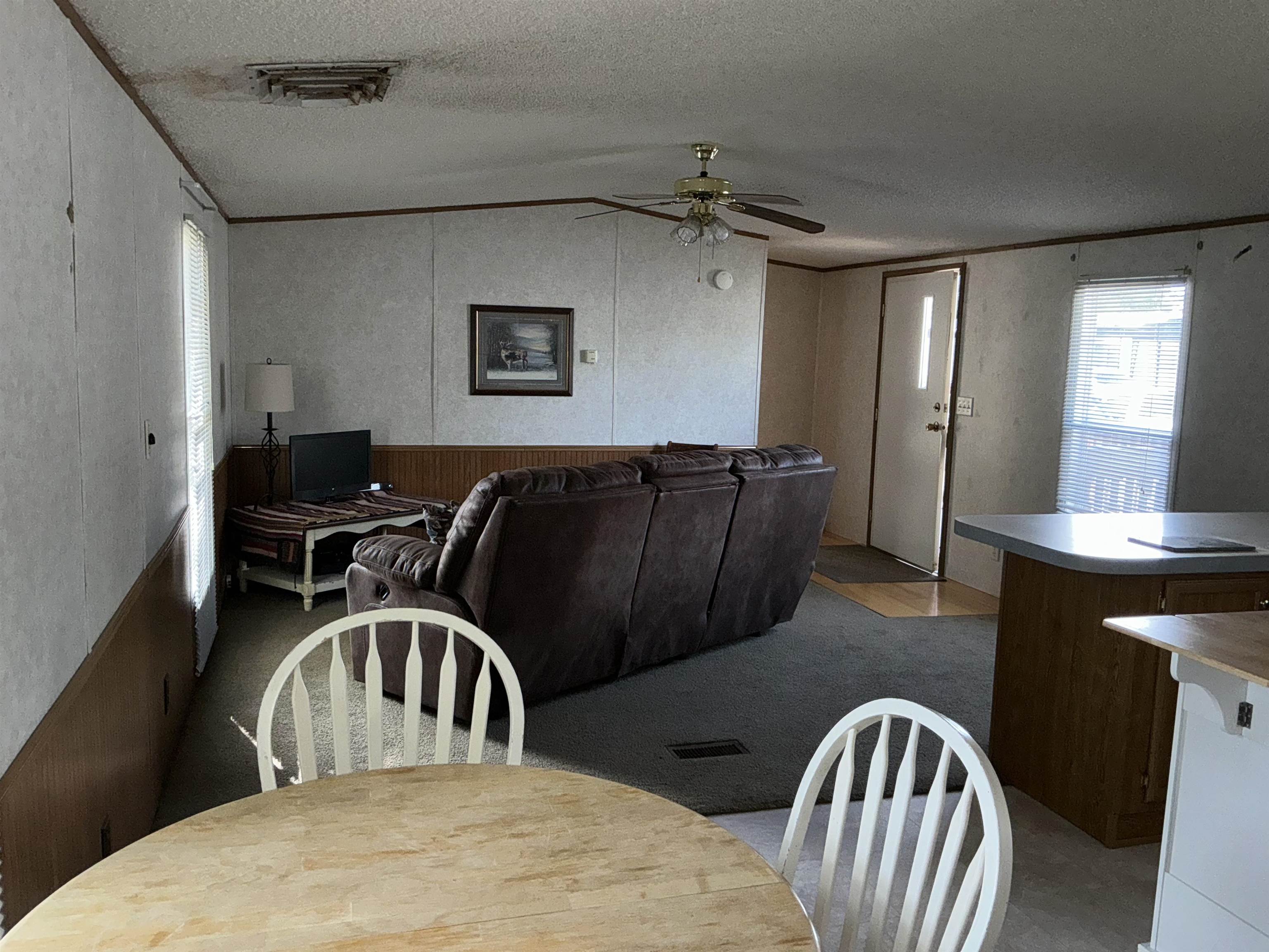 3268 E Road, Unit 90 Clifton, CO 81520 - Photo 7 of 19 a view of a dining room with furniture