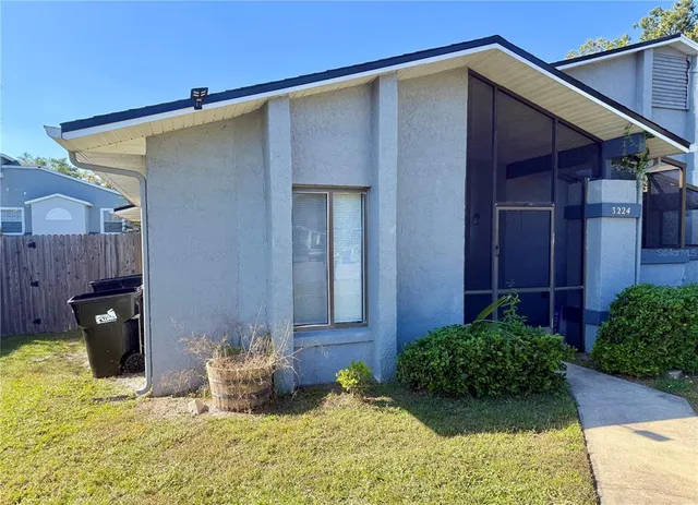 a view of a backyard of the house