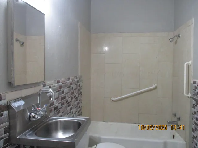 a bathroom with a sink and a bathtub