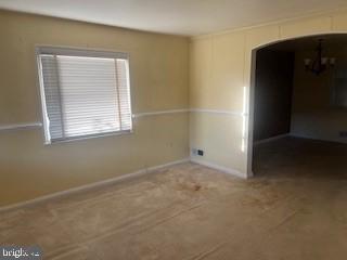 2746 Moorgate Road Baltimore, MD 21222 - Photo 3 of 14 an empty room with windows