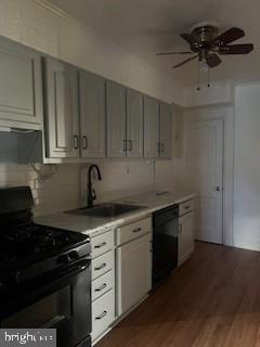 2746 Moorgate Road Baltimore, MD 21222 - Photo 5 of 14 a kitchen with granite countertop white cabinets and black appliances
