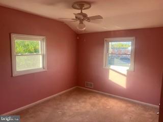 2746 Moorgate Road Baltimore, MD 21222 - Photo 8 of 14 an empty room with a window and a fan