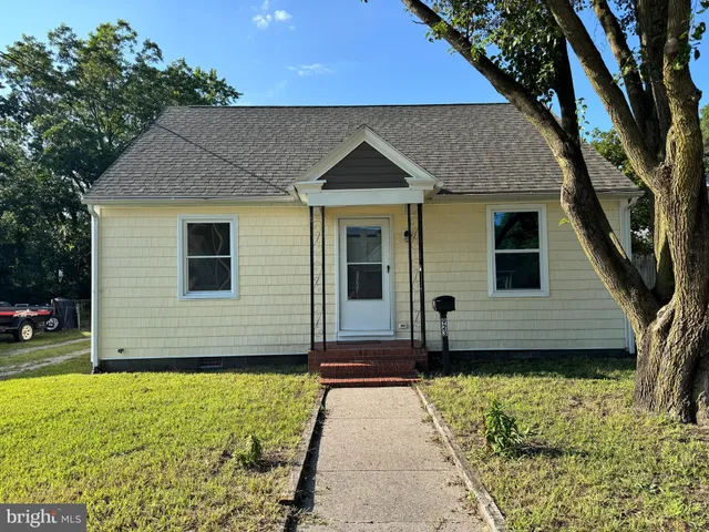a view of front of house with large windows