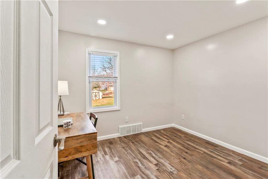 951 Shenango Road Beaver Falls, PA 15010 - Photo 15 of 42 a room with wooden floor and a window