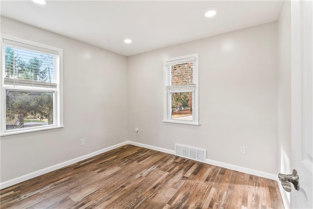 951 Shenango Road Beaver Falls, PA 15010 - Photo 16 of 42 a view of empty room with wooden floor and fan