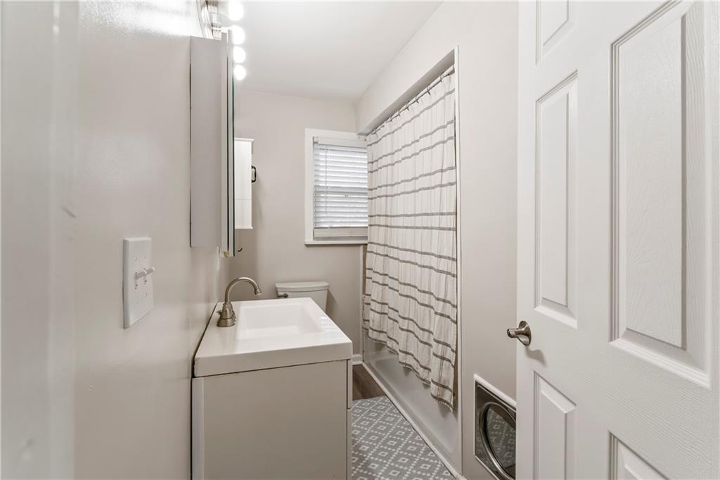 951 Shenango Road Beaver Falls, PA 15010 - Photo 18 of 42 a bathroom with a sink a toilet and shower
