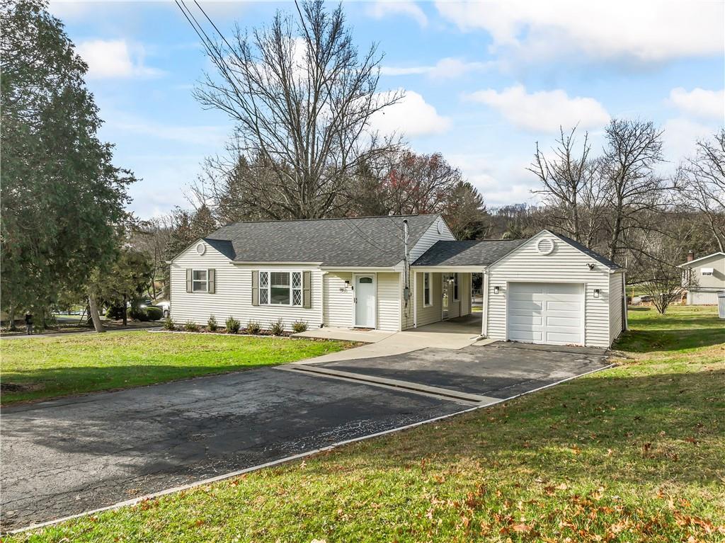951 Shenango Road Beaver Falls, PA 15010 - Photo 2 of 42 a front view of a house with a yard and trees
