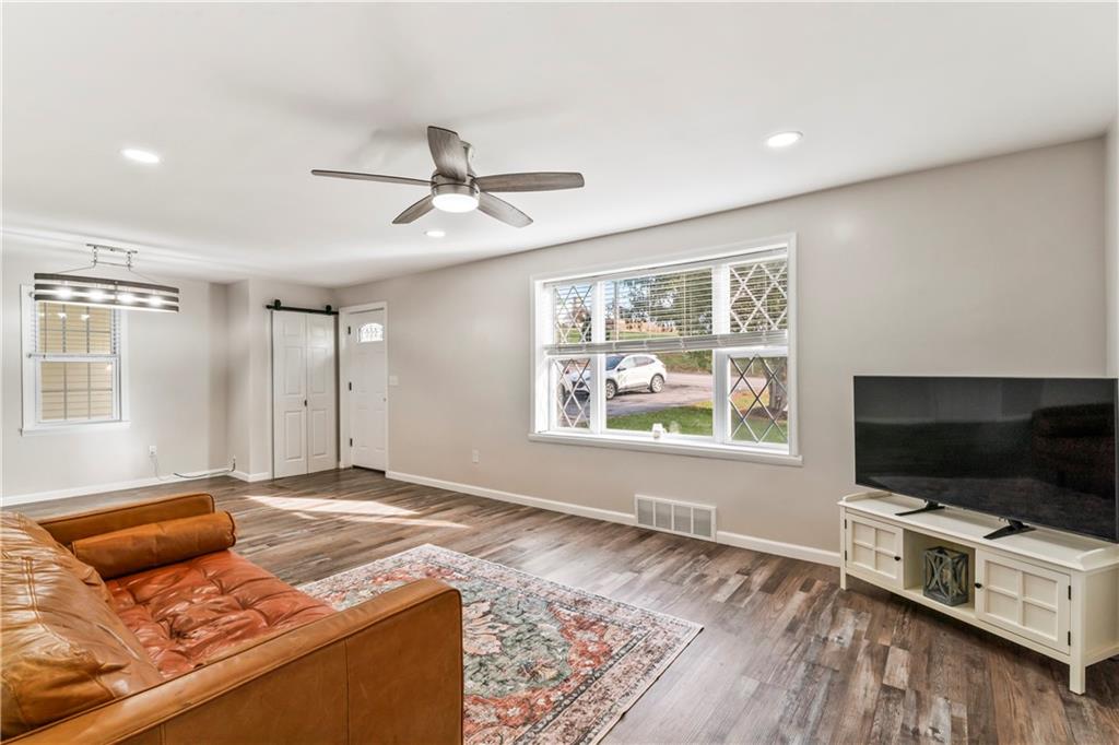 951 Shenango Road Beaver Falls, PA 15010 - Photo 5 of 42 a living room with furniture and a flat screen tv