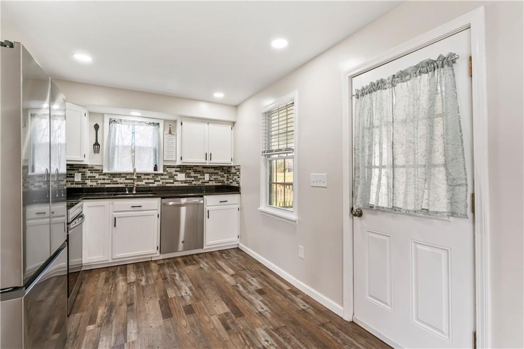 951 Shenango Road Beaver Falls, PA 15010 - Photo 10 of 42 a kitchen with a refrigerator and white cabinets