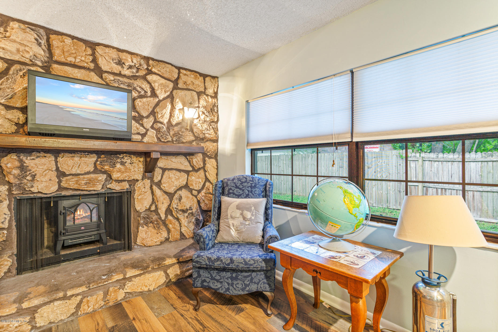 325 Orchis Road St. Augustine, FL 32086 - Photo 16 of 46 a view of a livingroom with furniture and a fireplace