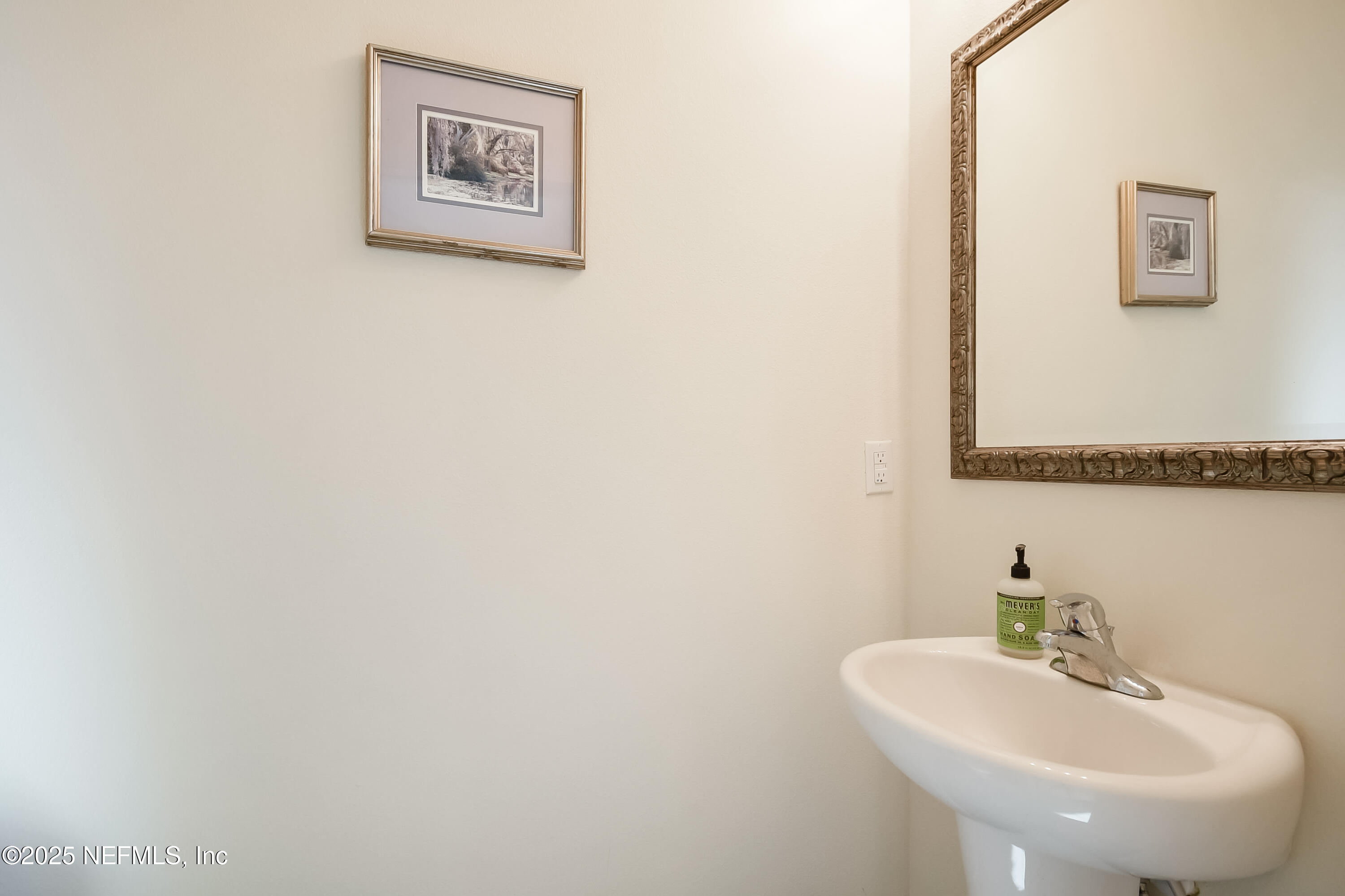 94 Red House Cir Street St. Augustine, FL 32084 - Photo 11 of 28 a bathroom with a sink and a mirror