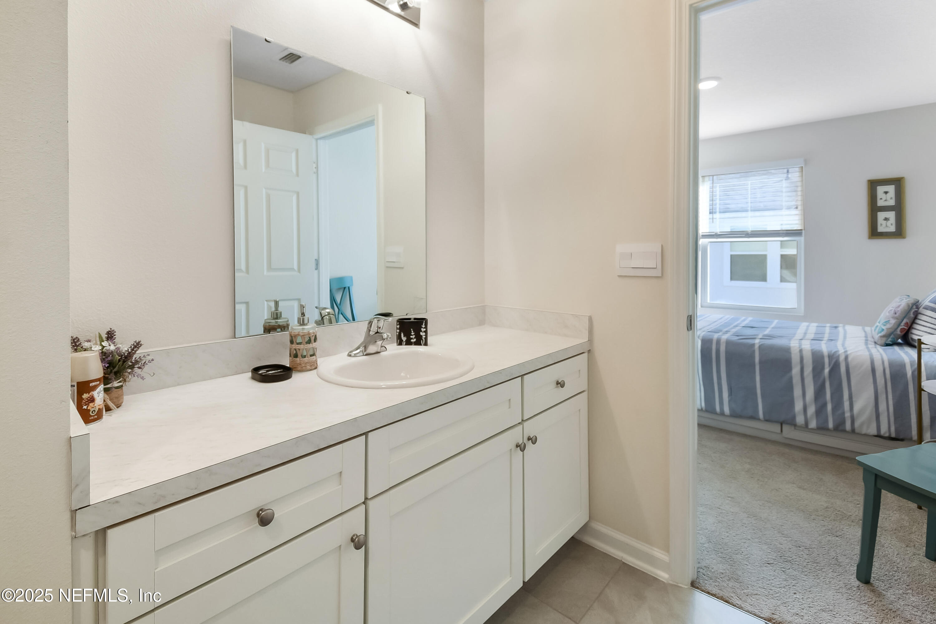 94 Red House Cir Street St. Augustine, FL 32084 - Photo 16 of 28 a bathroom with a sink and a mirror