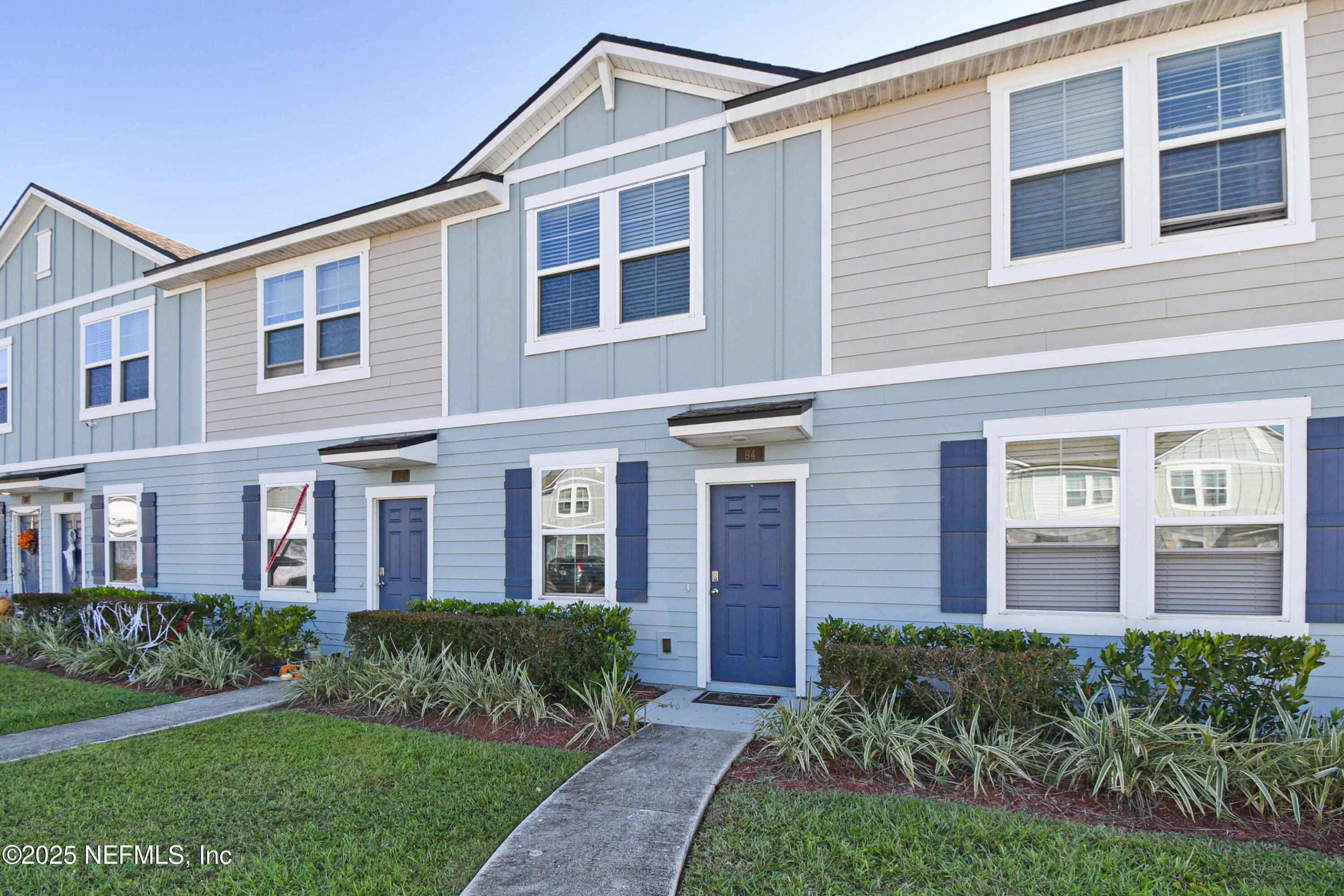 94 Red House Cir Street St. Augustine, FL 32084 - Photo 24 of 28 a front view of a house with garden