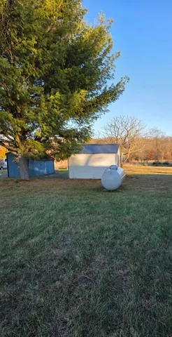 a view of an ocean and a yard