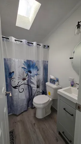a view of a bathroom with a sink and mirror