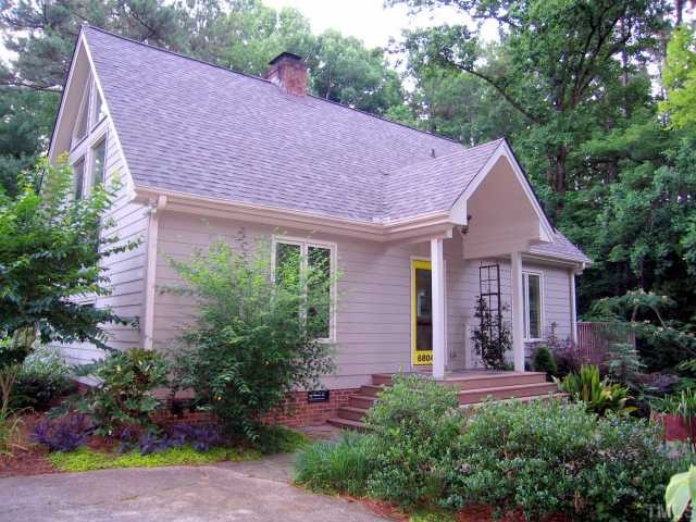 8804 Boar's Head Court Raleigh, NC 27613 - Photo 2 of 12 a aerial view of a house with a yard and plants
