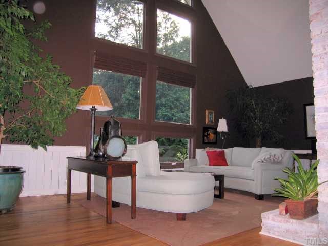 8804 Boar's Head Court Raleigh, NC 27613 - Photo 3 of 12 a living room with furniture and a potted plant