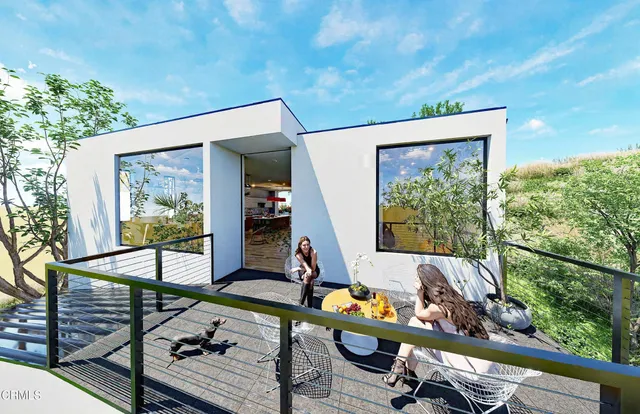 a room with stainless steel appliances kitchen island granite countertop a sink and cabinets