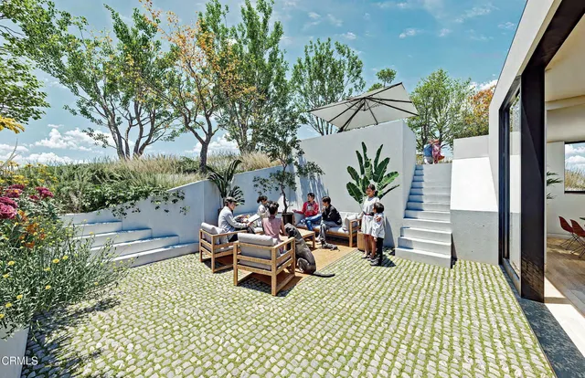 a view of a couches and dinning table in patio