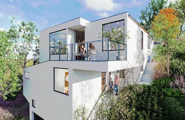 an aerial view of a house with yard