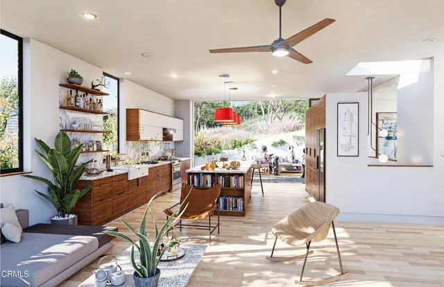 a living room with furniture and potted plant