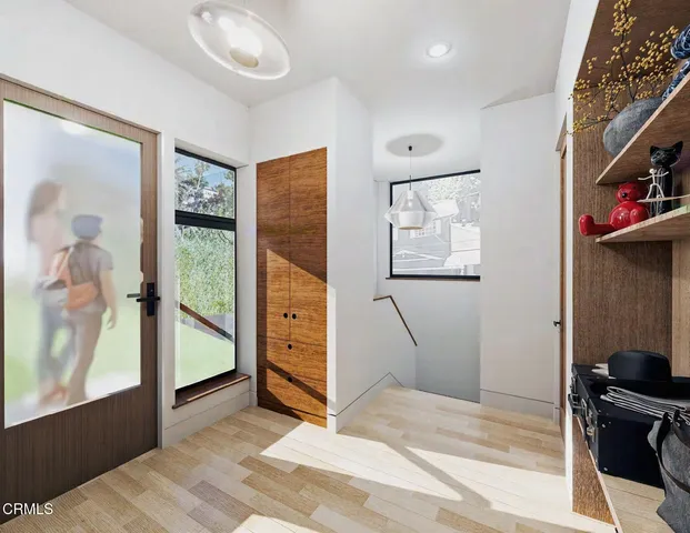 a view of a porch with furniture and garden
