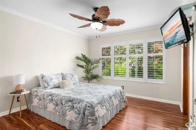 a bedroom with a large bed and a window