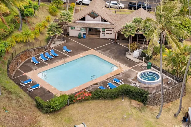 an aerial view of a house with garden space and street view