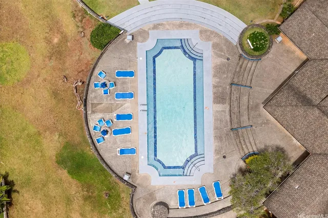 swimming pool view with seating space