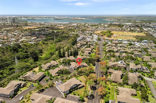 an aerial view of residential building and lake