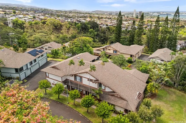 an aerial view of residential houses with outdoor space