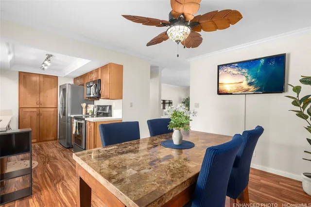 a view of a dining room with furniture and wooden floor